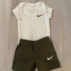 Nike White Baby Bodysuit with Black Swoosh